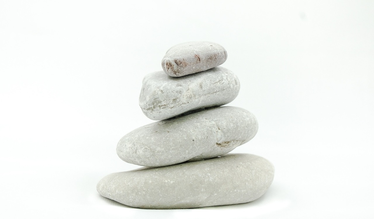 stones stacked upon one another - mindful soul center magazine