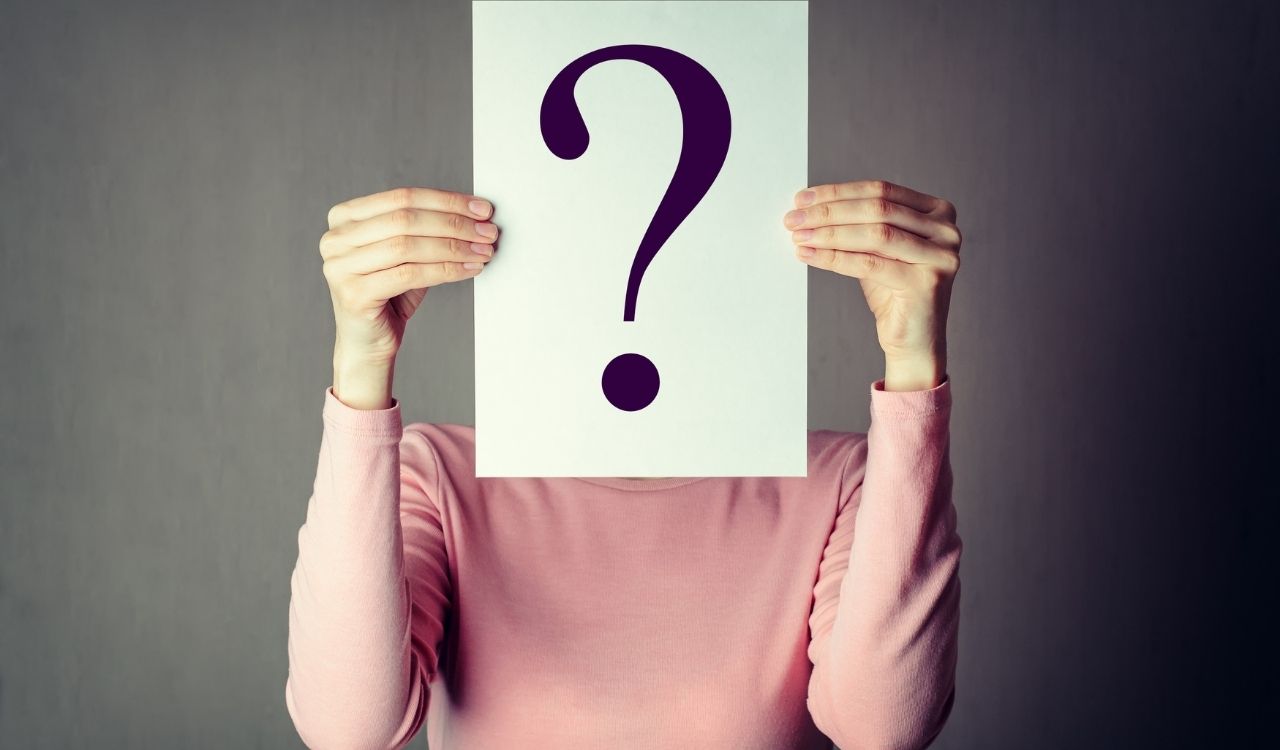 Woman Holding a card with a Question Mark: What is that? Mindful Soul Center magazine