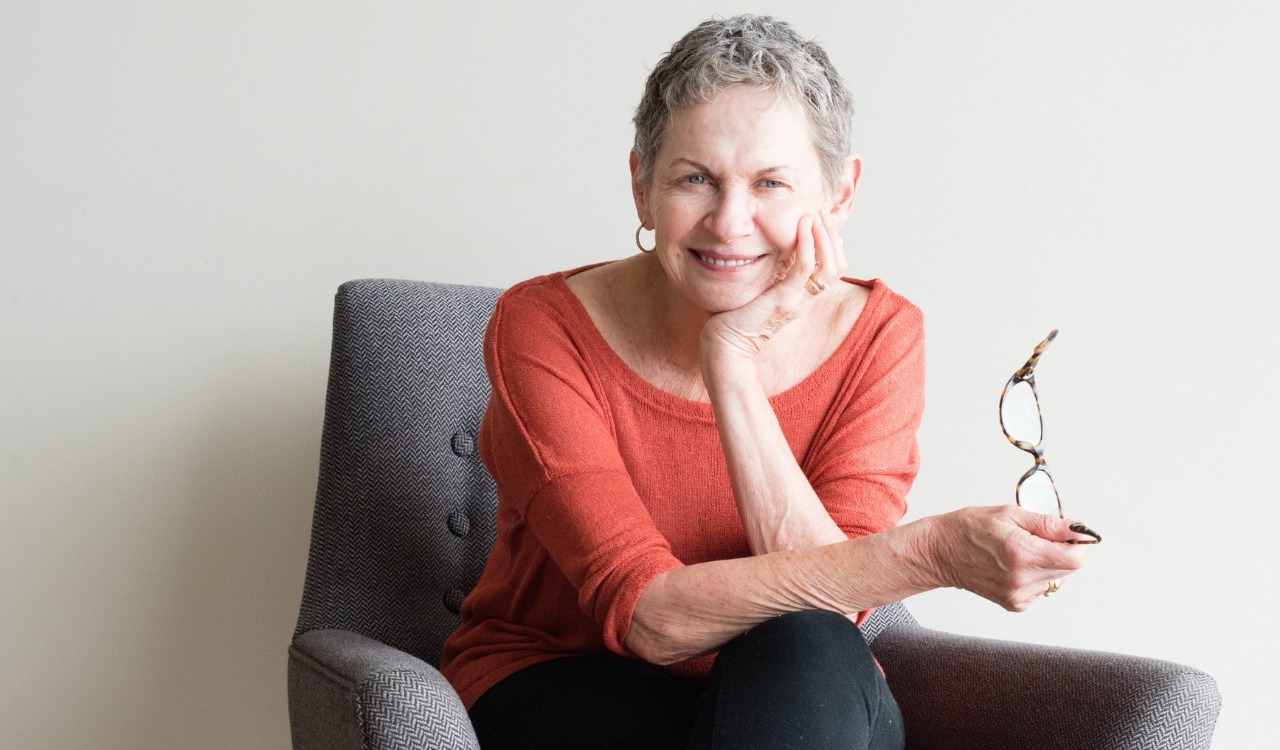 Are you alone? or lonely? What's the difference? - older woman contented sitting on a chair