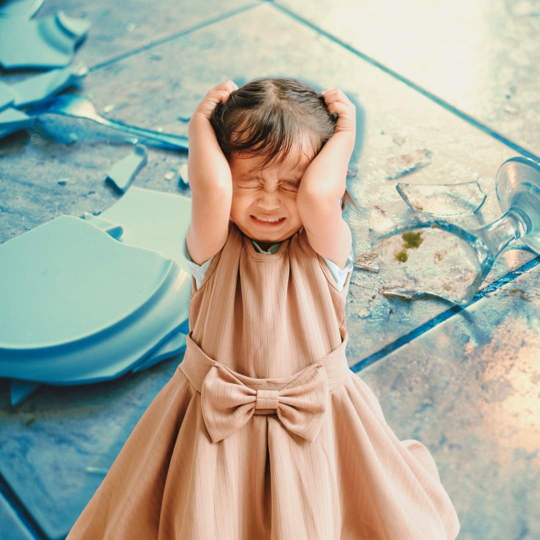 illustration for mindful soul center magazine - frightened girl in dress with broken dishes on the floor